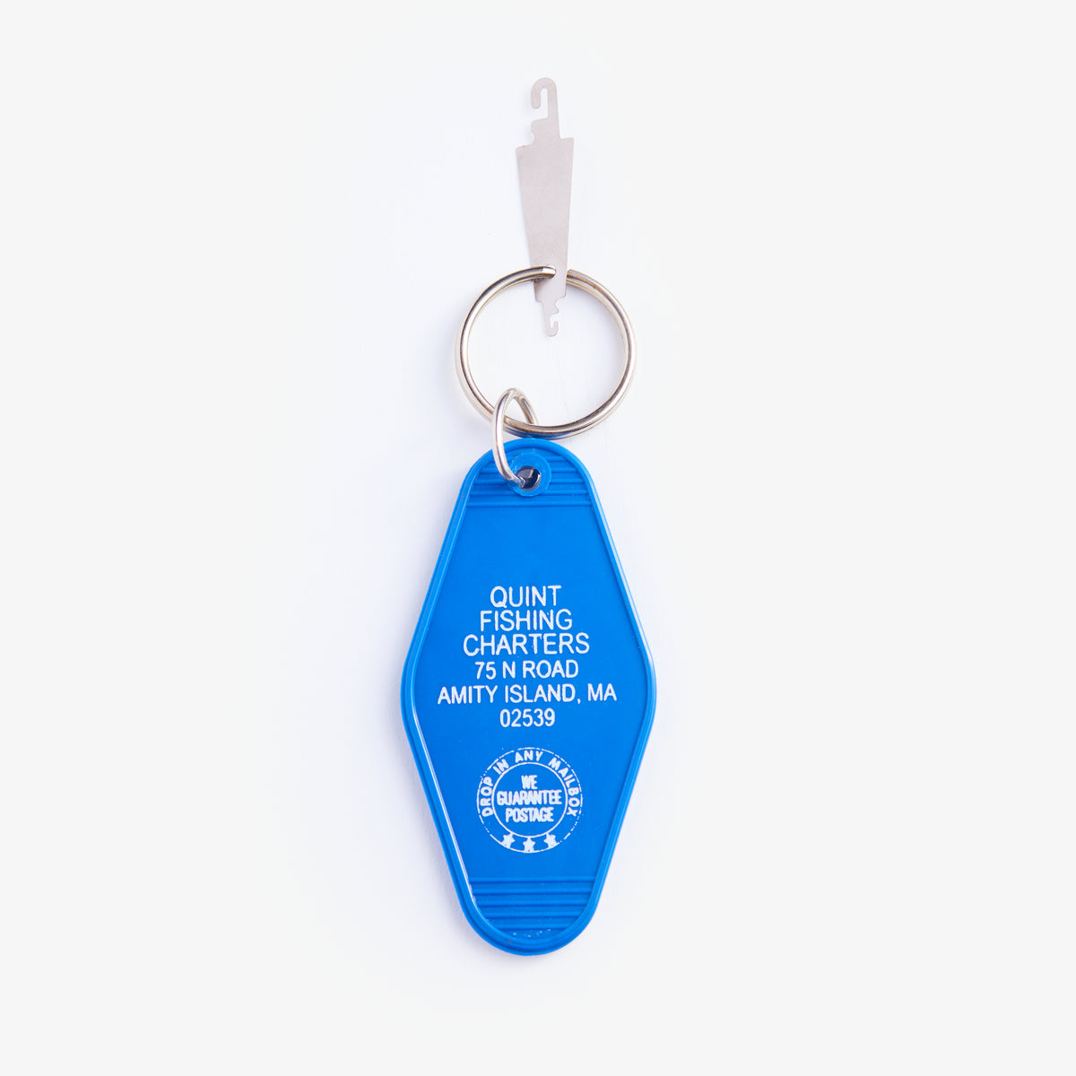 Blue keychain with text on a white background
