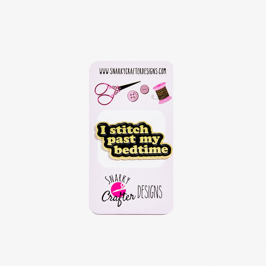 Pin with 'I stitch past my bedtime' text on a card with Snarky Crafter Designs branding.