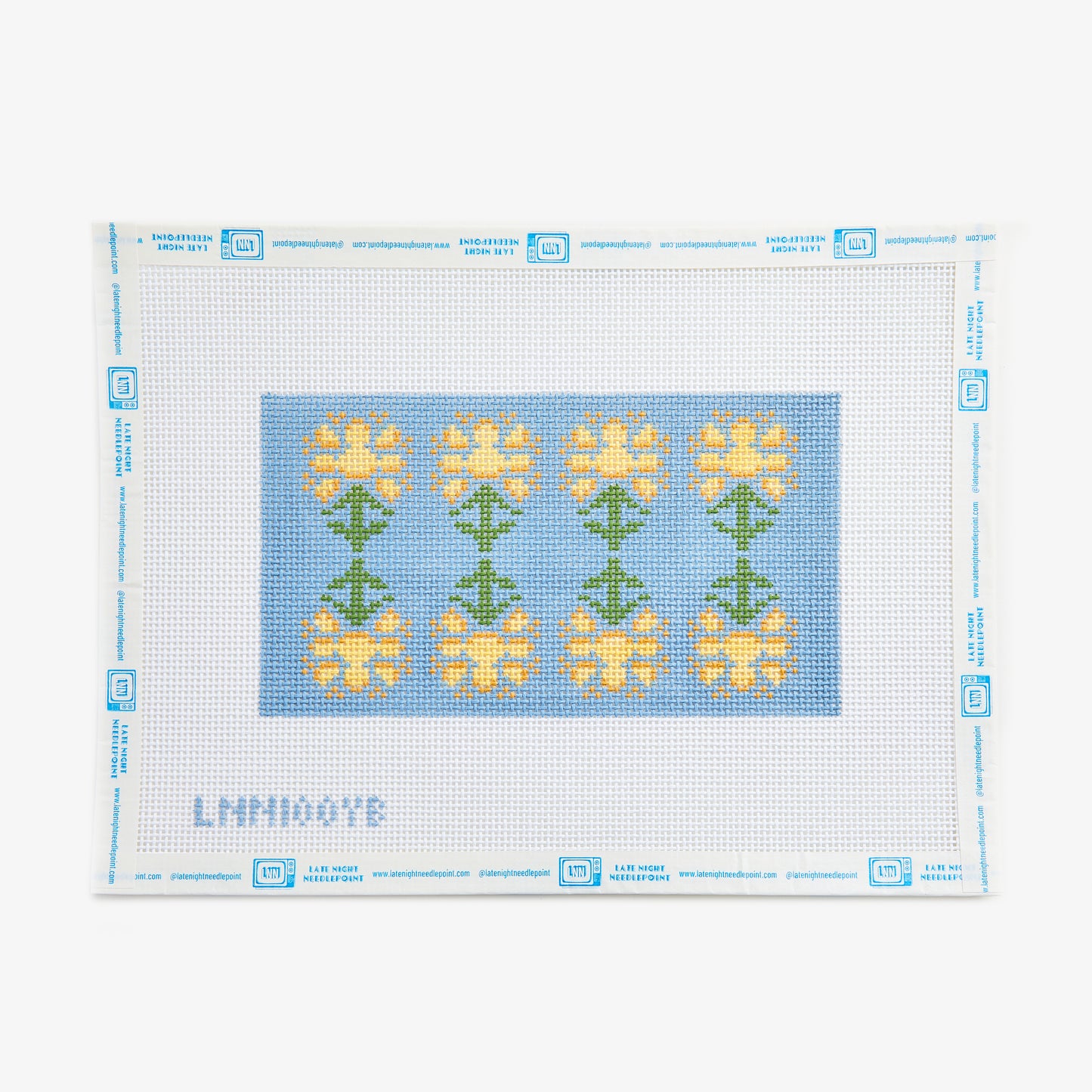 Cross-stitch pattern with yellow flowers on a blue background, framed by a white border.