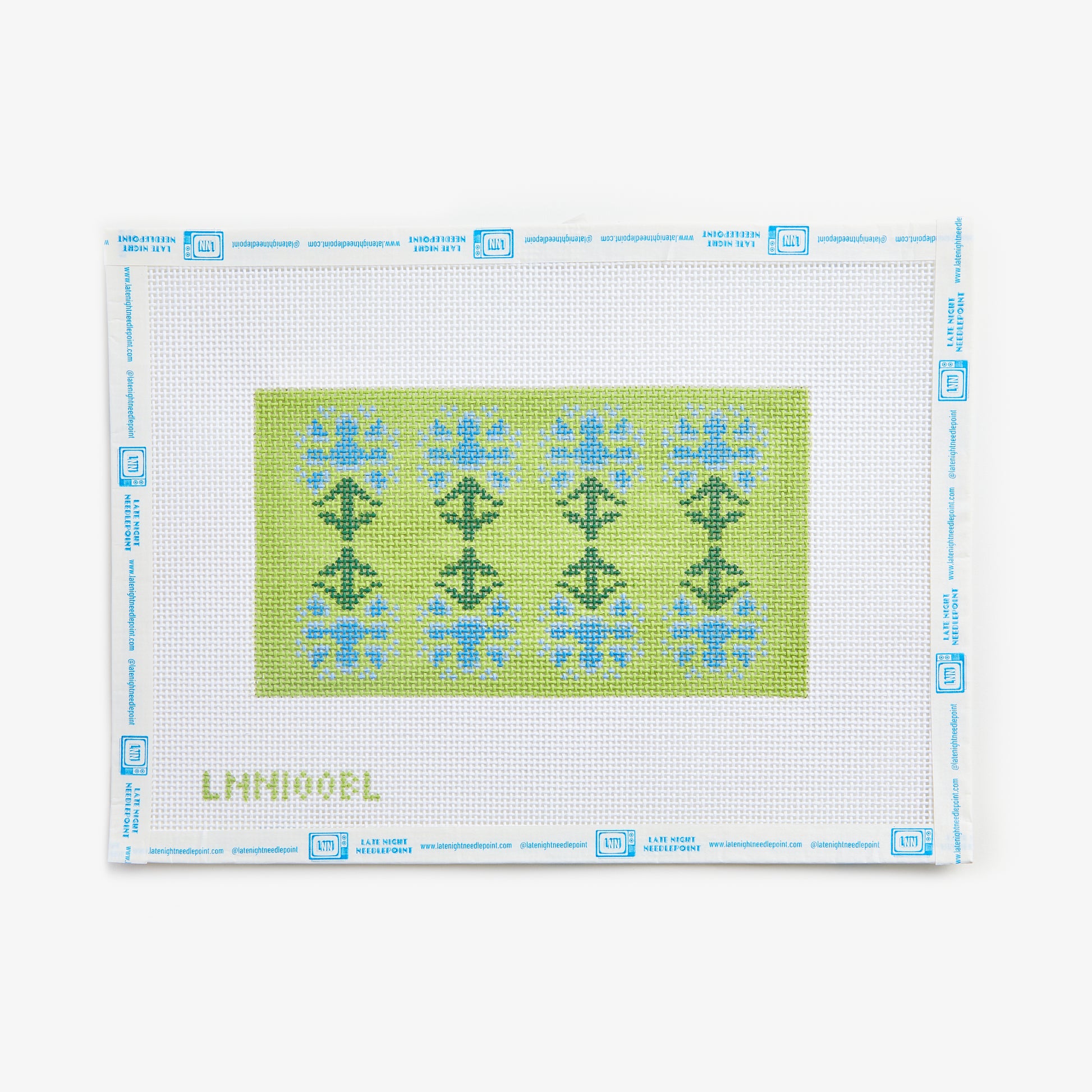 Cross-stitch pattern with green and blue designs on a white background