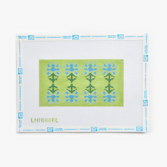 Cross-stitch pattern with green and blue designs on a white background