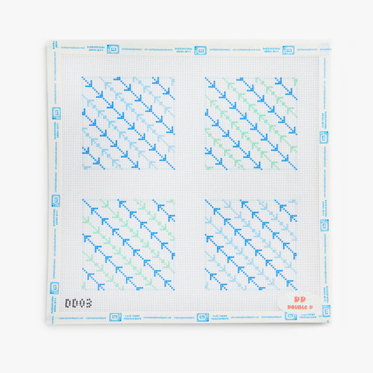 Cross-stitch pattern with blue and green threads on a white background
