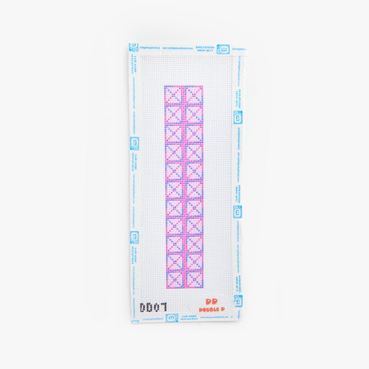 Cross stitch chart with pink and blue patterns on a white background