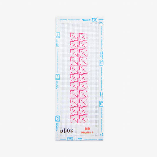 Cross-stitching pattern with red designs on a white background
