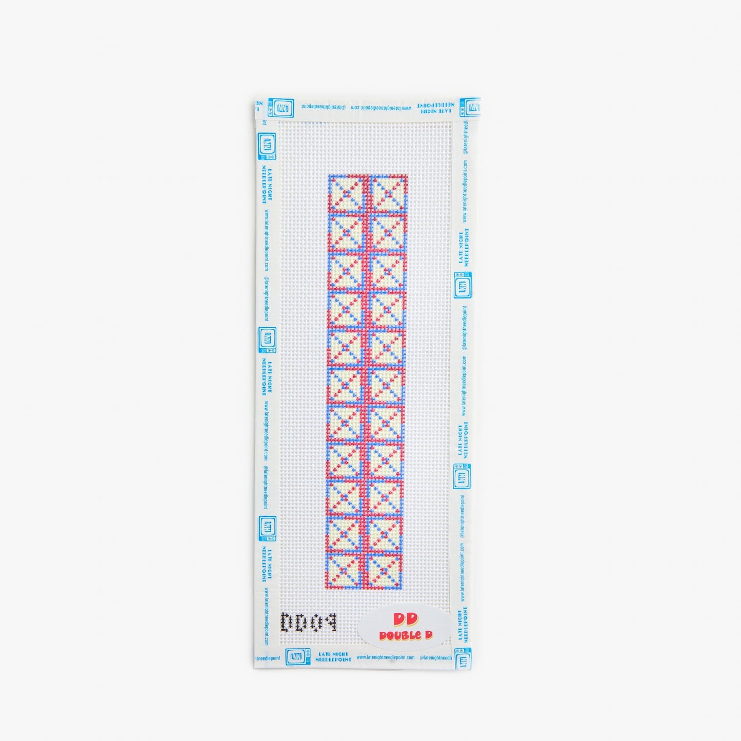 Cross stitch pattern on a white fabric with blue border and red and blue geometric design.