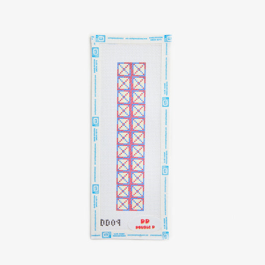 Cross stitch pattern on a white fabric with blue border and red and blue geometric design.