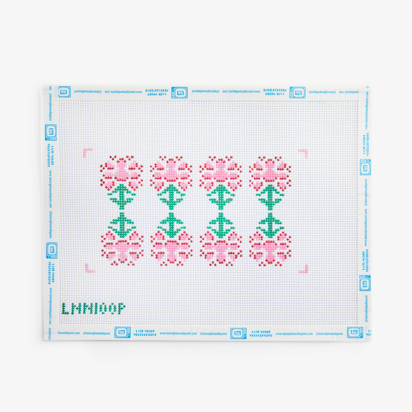 Cross-stitch pattern with pink and green flowers on a white background