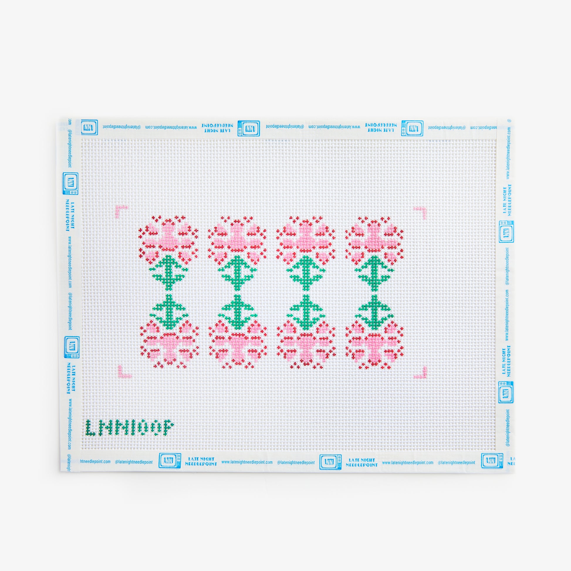 Cross-stitch pattern with pink and green flowers on a white background