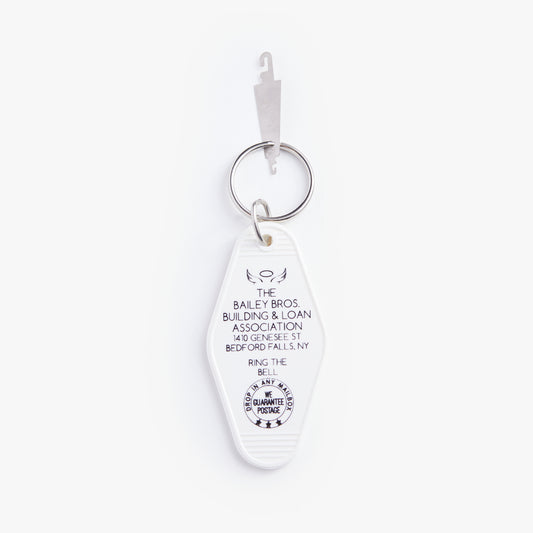 White keychain with text on a white background